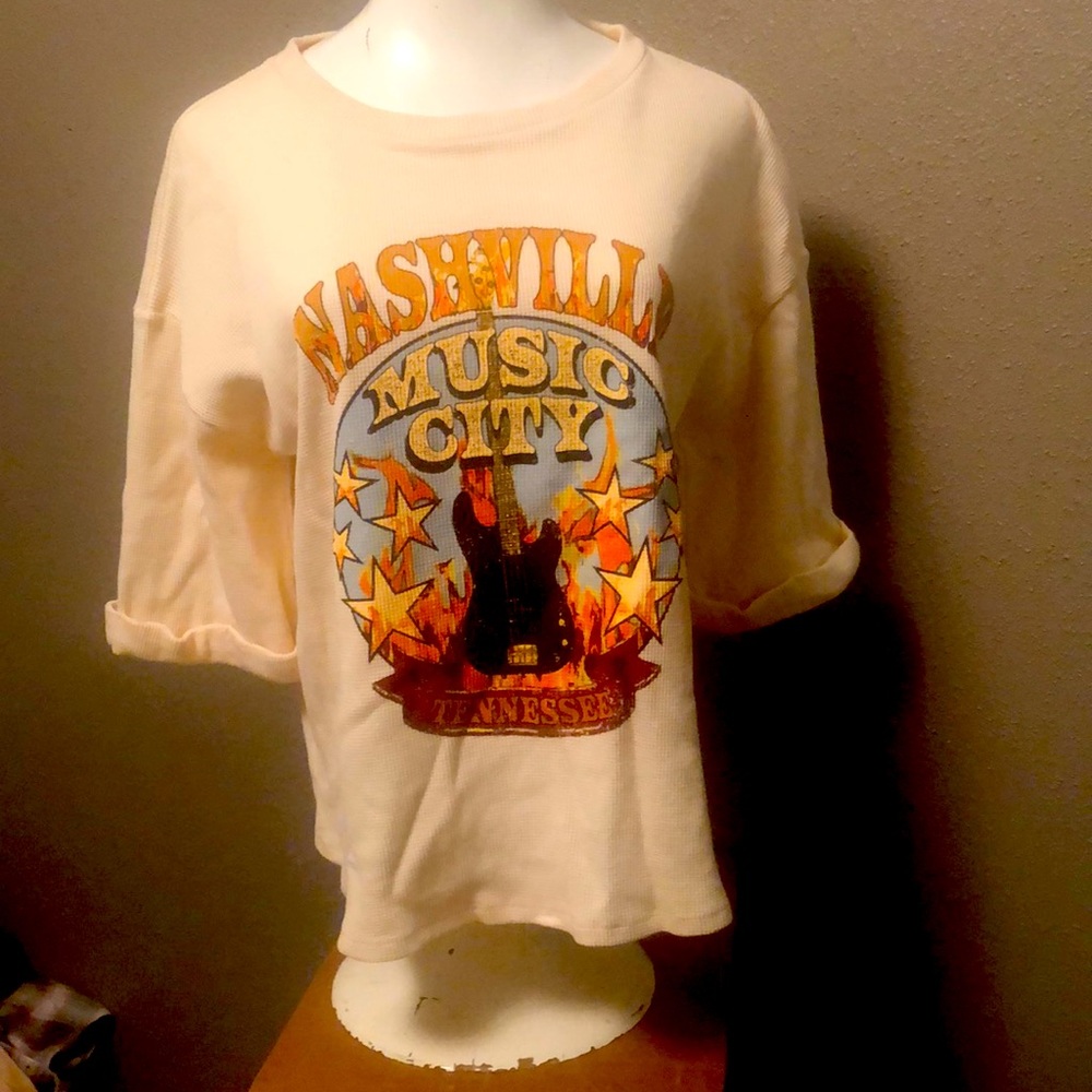 3/4 length sleeved thermal Nashville shirt.